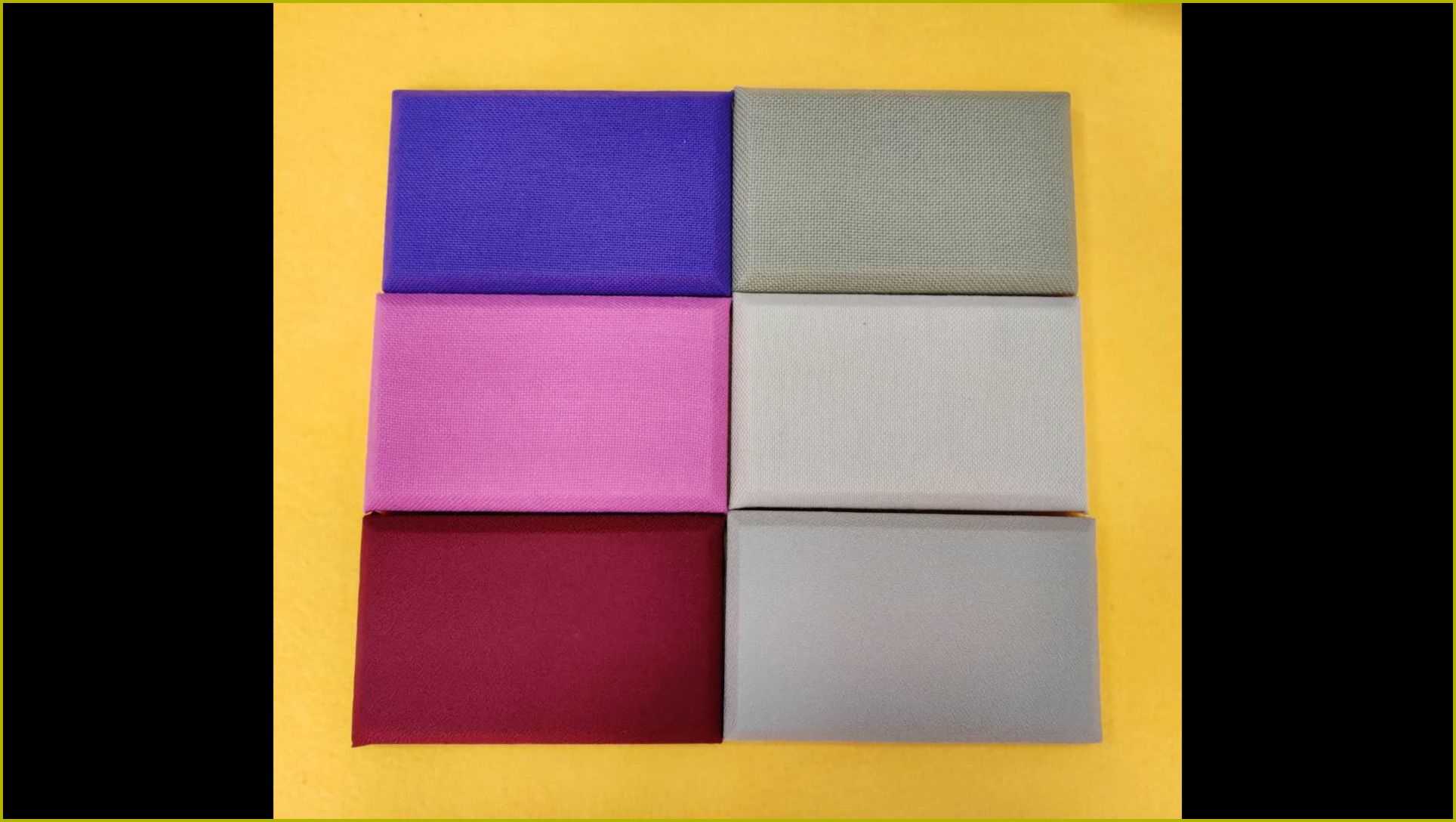 多种颜色布艺软包吸音板样品，织物面料包覆高密度海绵，墙面吸音防撞装饰材料